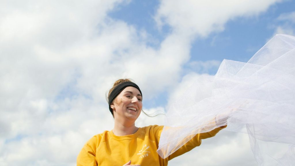 woman holding white veil