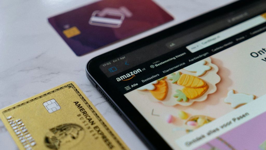 a smart phone sitting next to a credit card