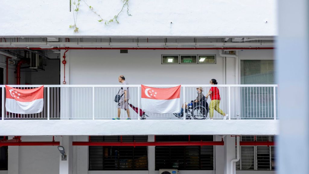 a group of people walking across a bridge
