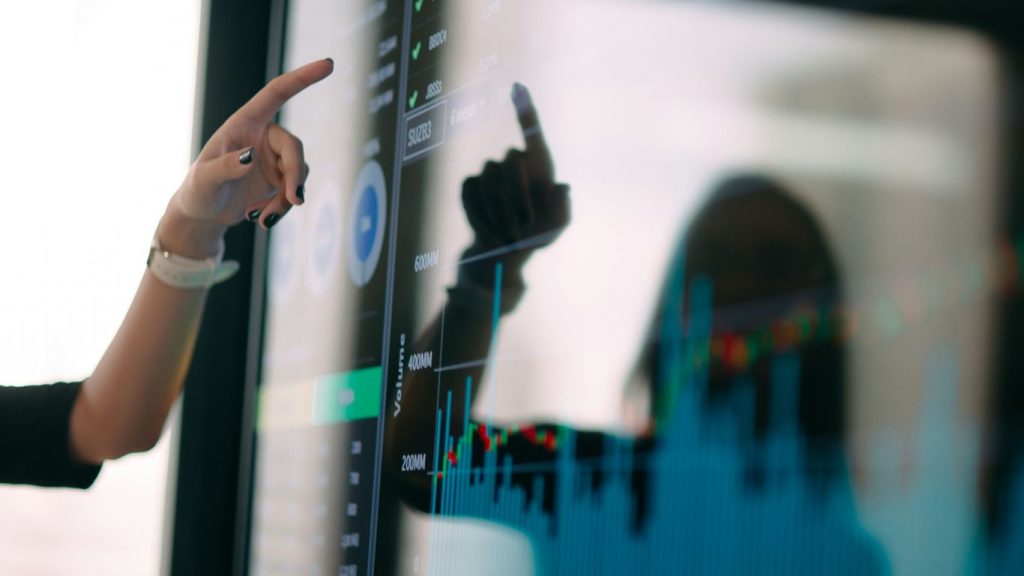 person holding black smartphone in front of mirror