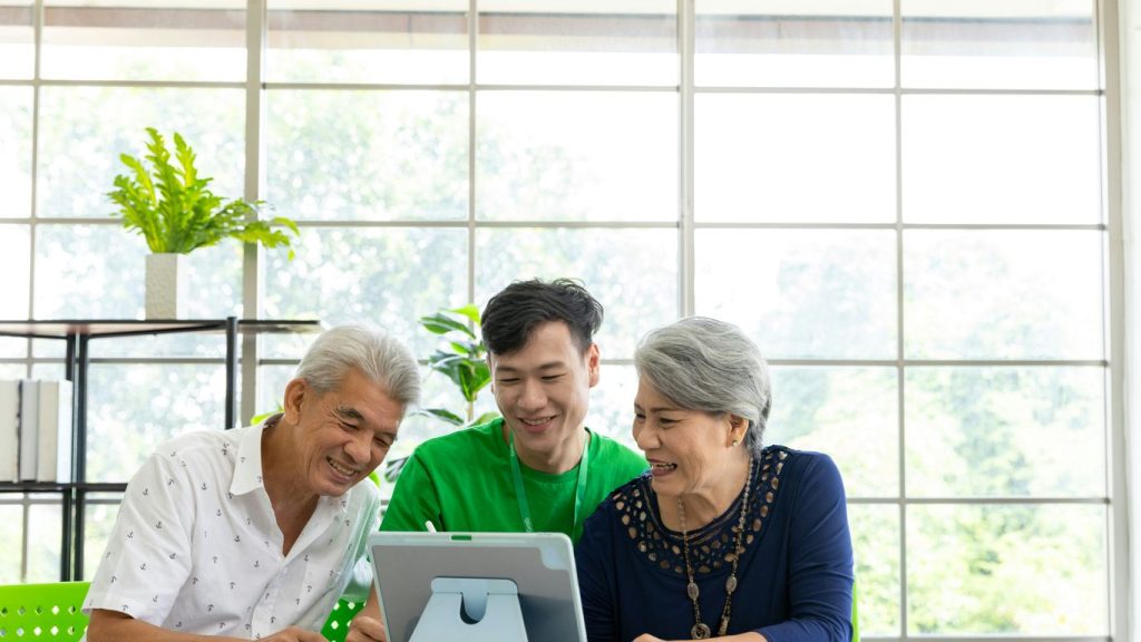 a couple of people that are looking at a tablet