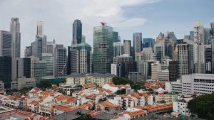 houses near high-rise buildings during daytime