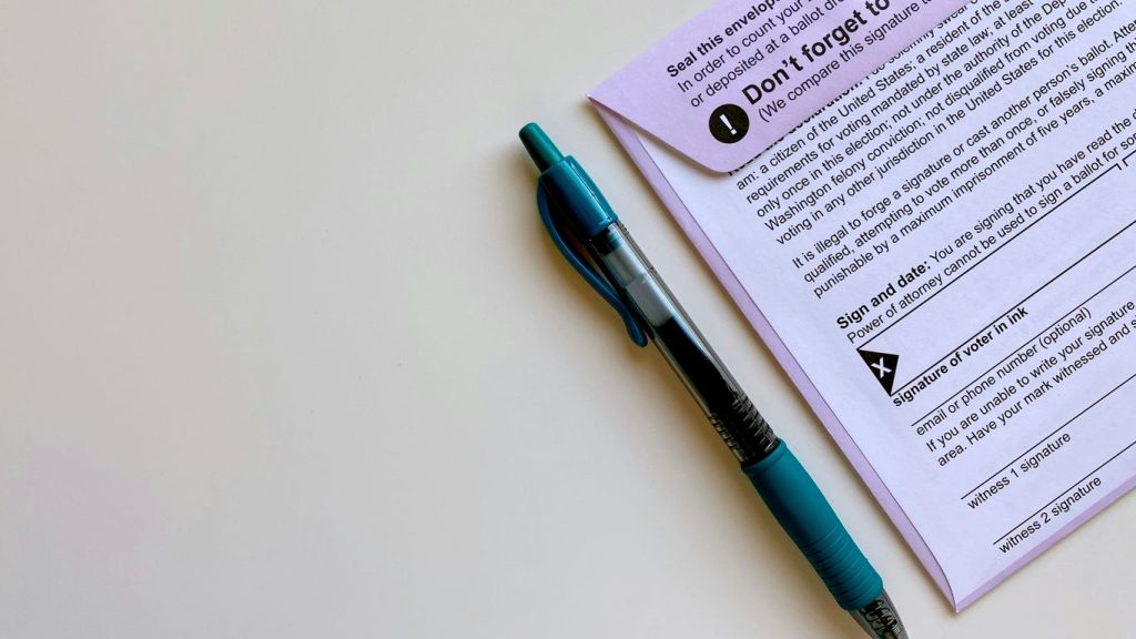 a pen sitting on top of a piece of paper