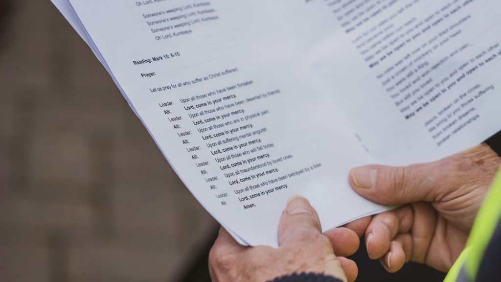 a close up of a person holding a piece of paper