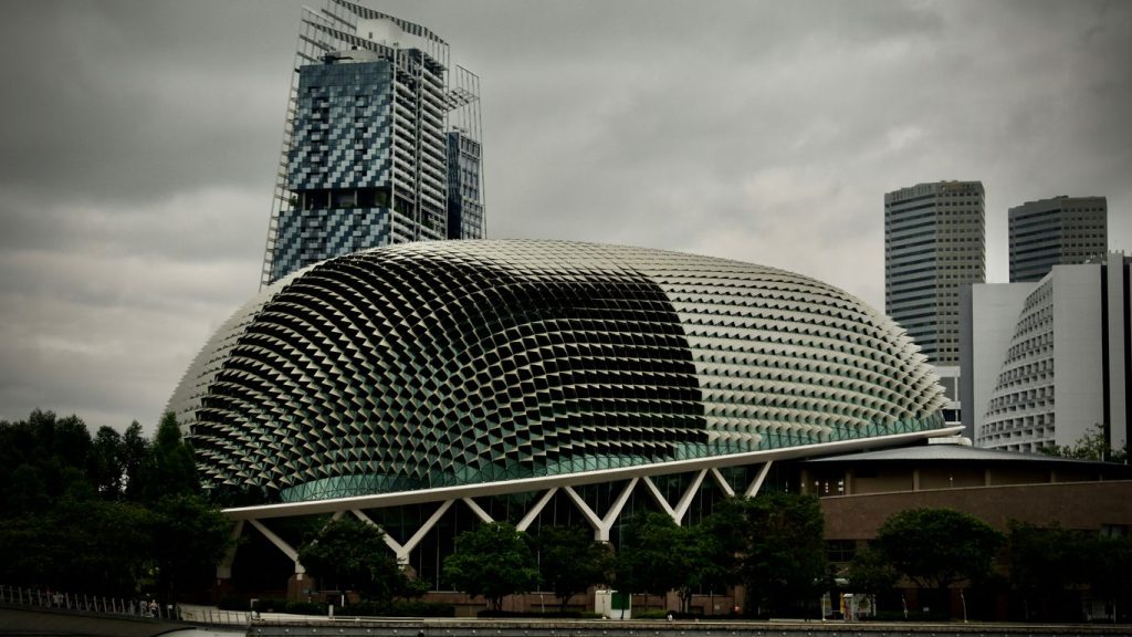 gray and black concrete building under gray sky during daytime