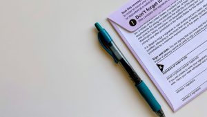 a pen sitting on top of a piece of paper
