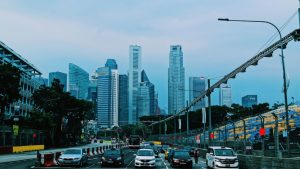 cars on road near high rise buildings during daytime