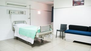 hospital bed near couch