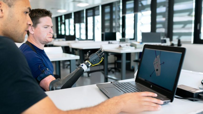 man in blue crew neck t-shirt using black laptop computer
