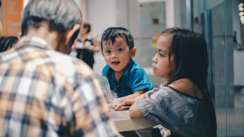 A group of people sitting around a table