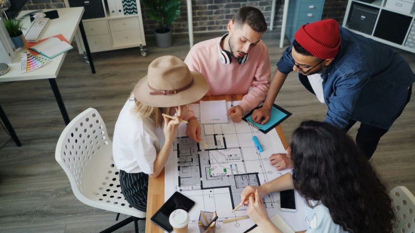 a group of people playing a board game