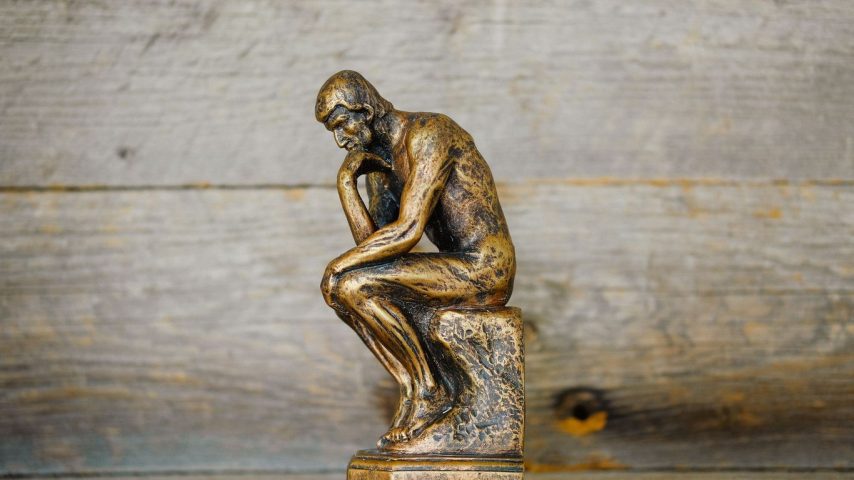 green ceramic statue of a man