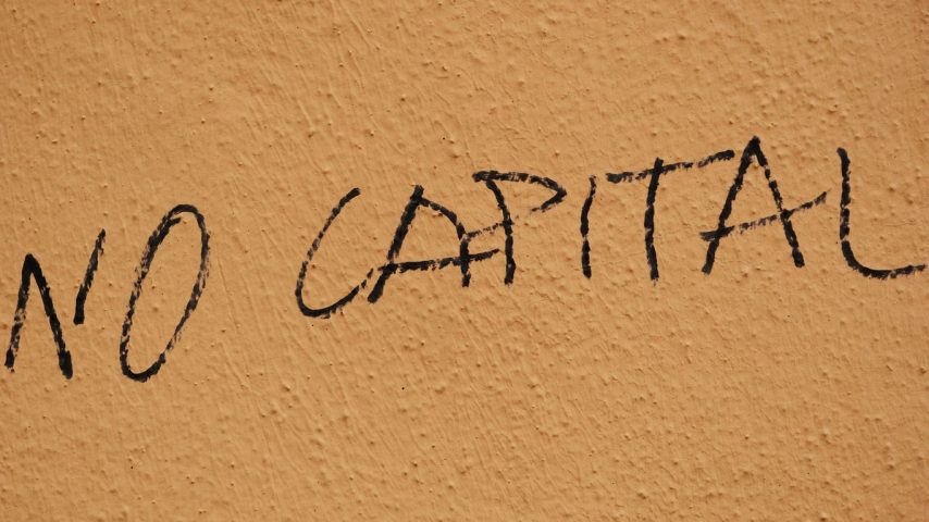 The word no capital written on a wall