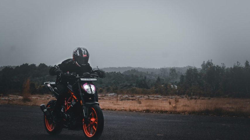 a person riding a motorcycle on a road